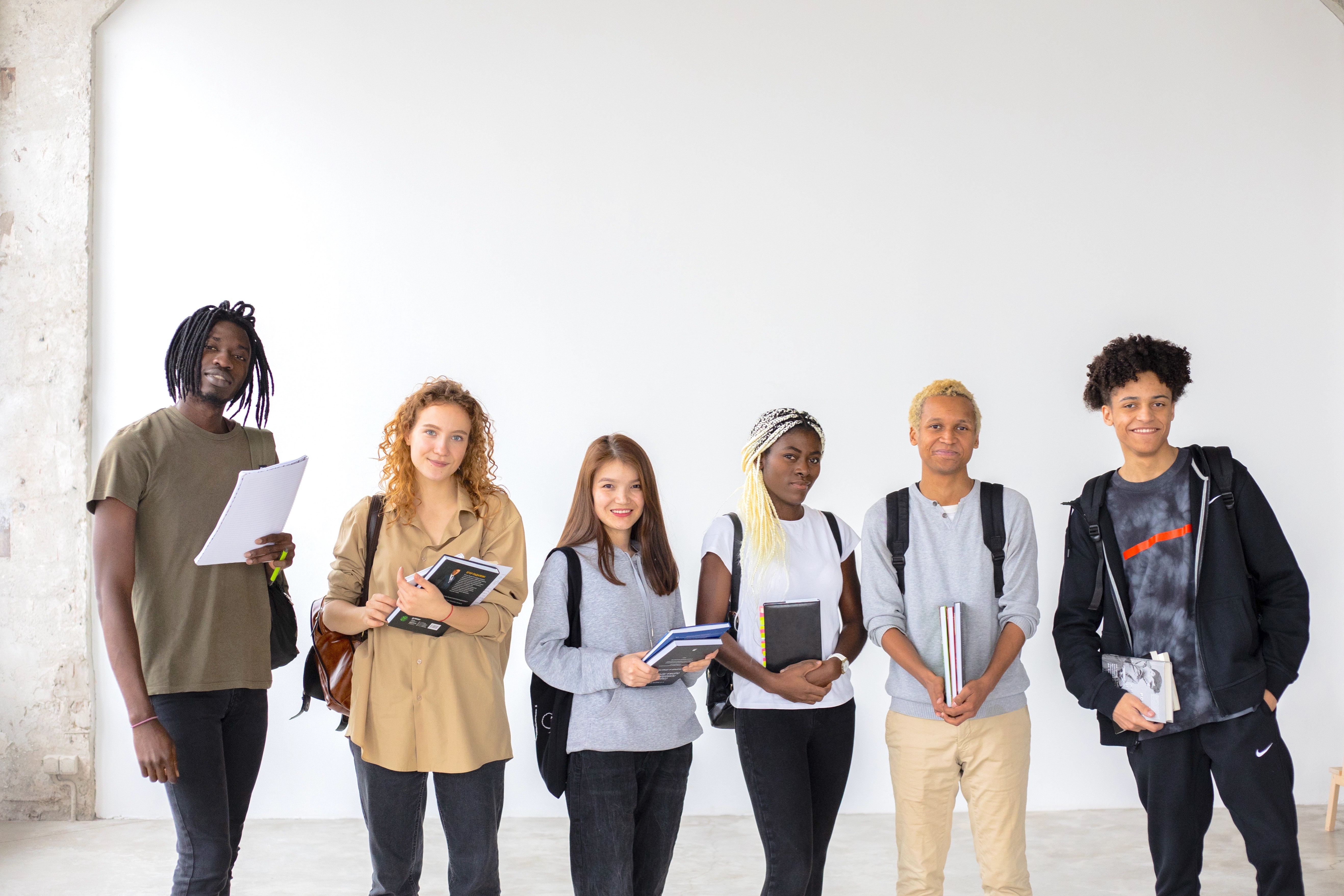 Group of Multiethnic Students with Books and Documents