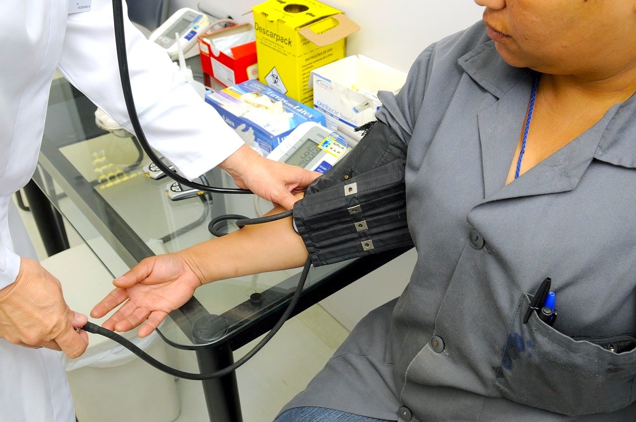 Doctor Checking the Blood Pressure of a Patient 
