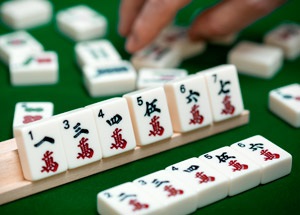 close up of mahjong tiles on a stand