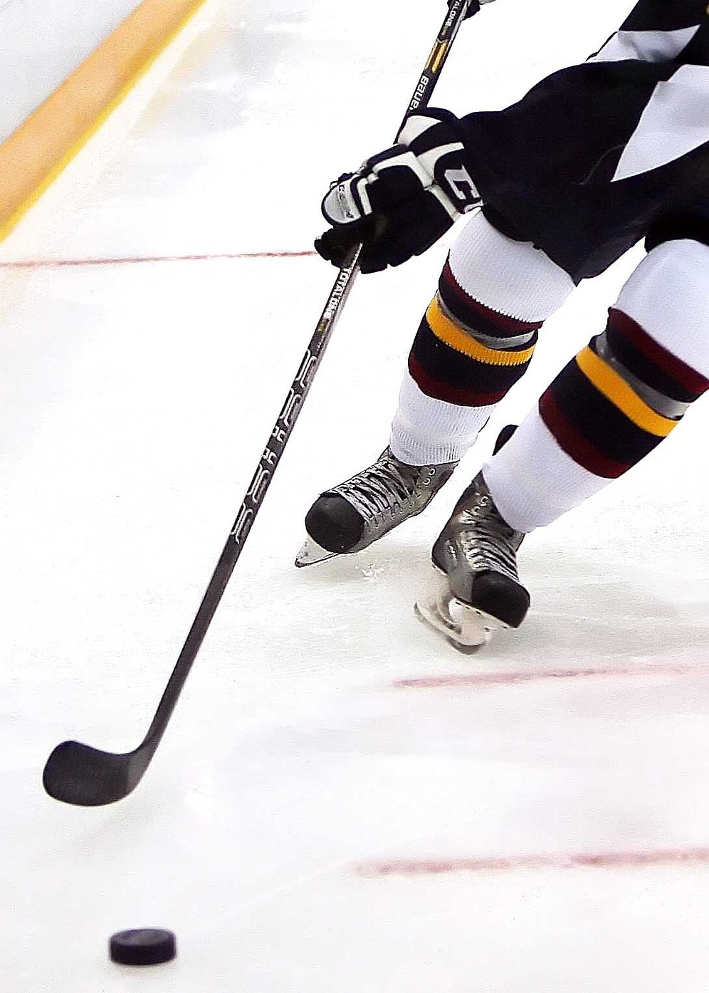 Ice Hockey player moving the puck