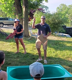 Two Mass Wildlife experts giving demonstration at the dam