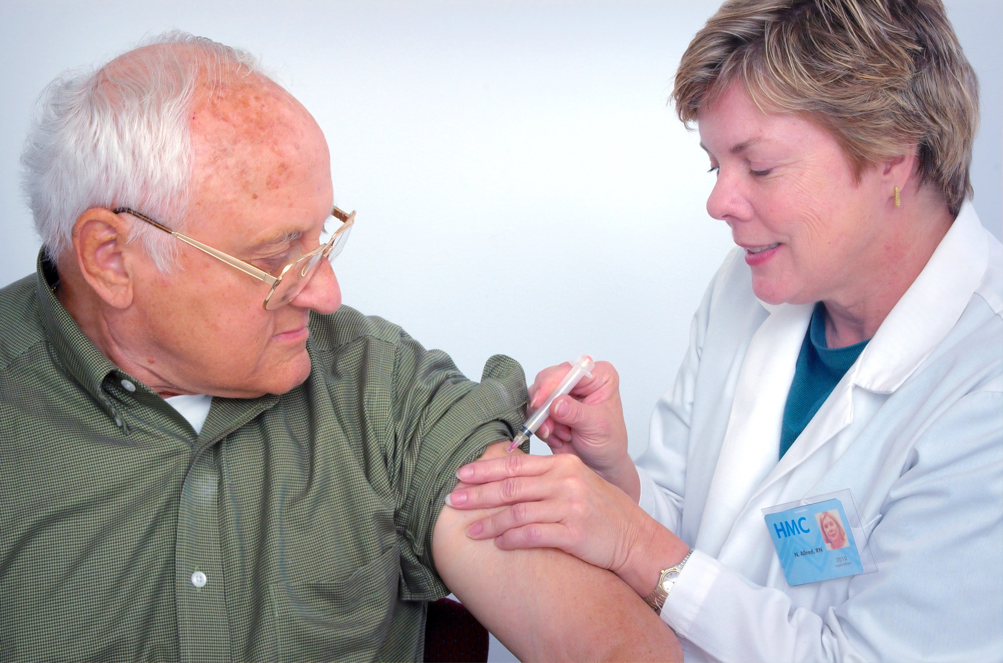 Senior Male Adult Getting a Vaccine Shot