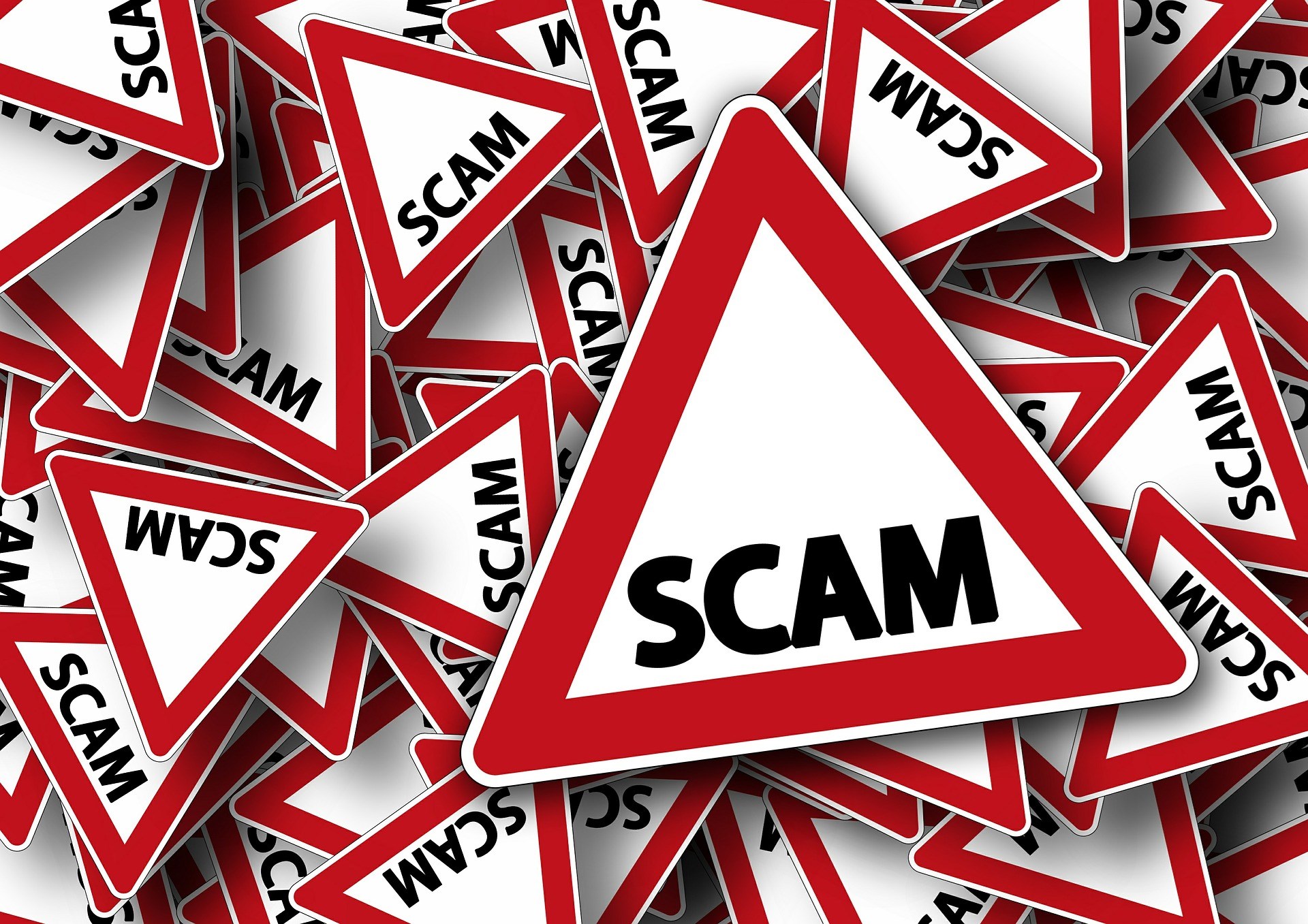 Red and White Scam Warning Signs
