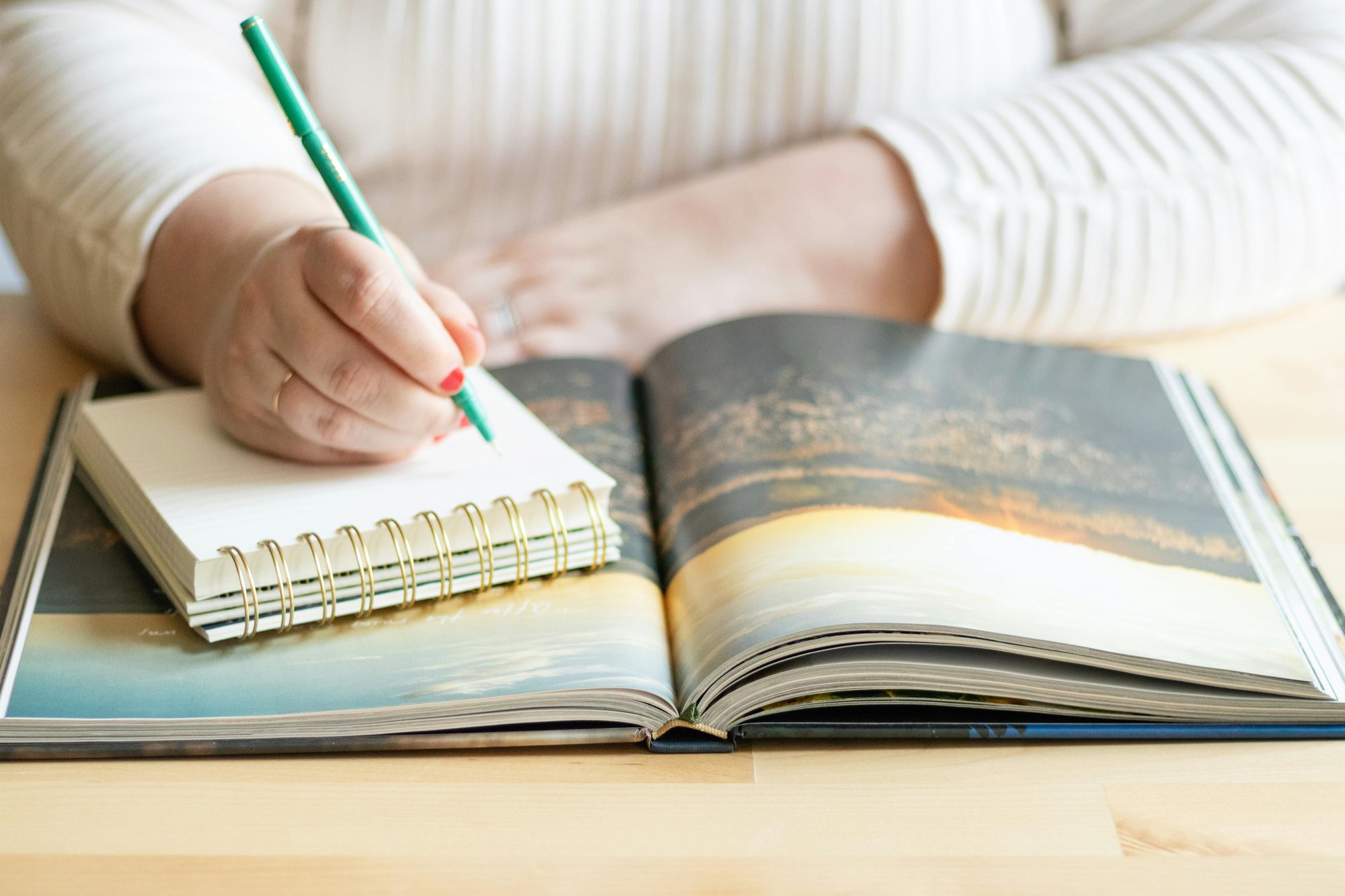 Woman Writing in Notepad