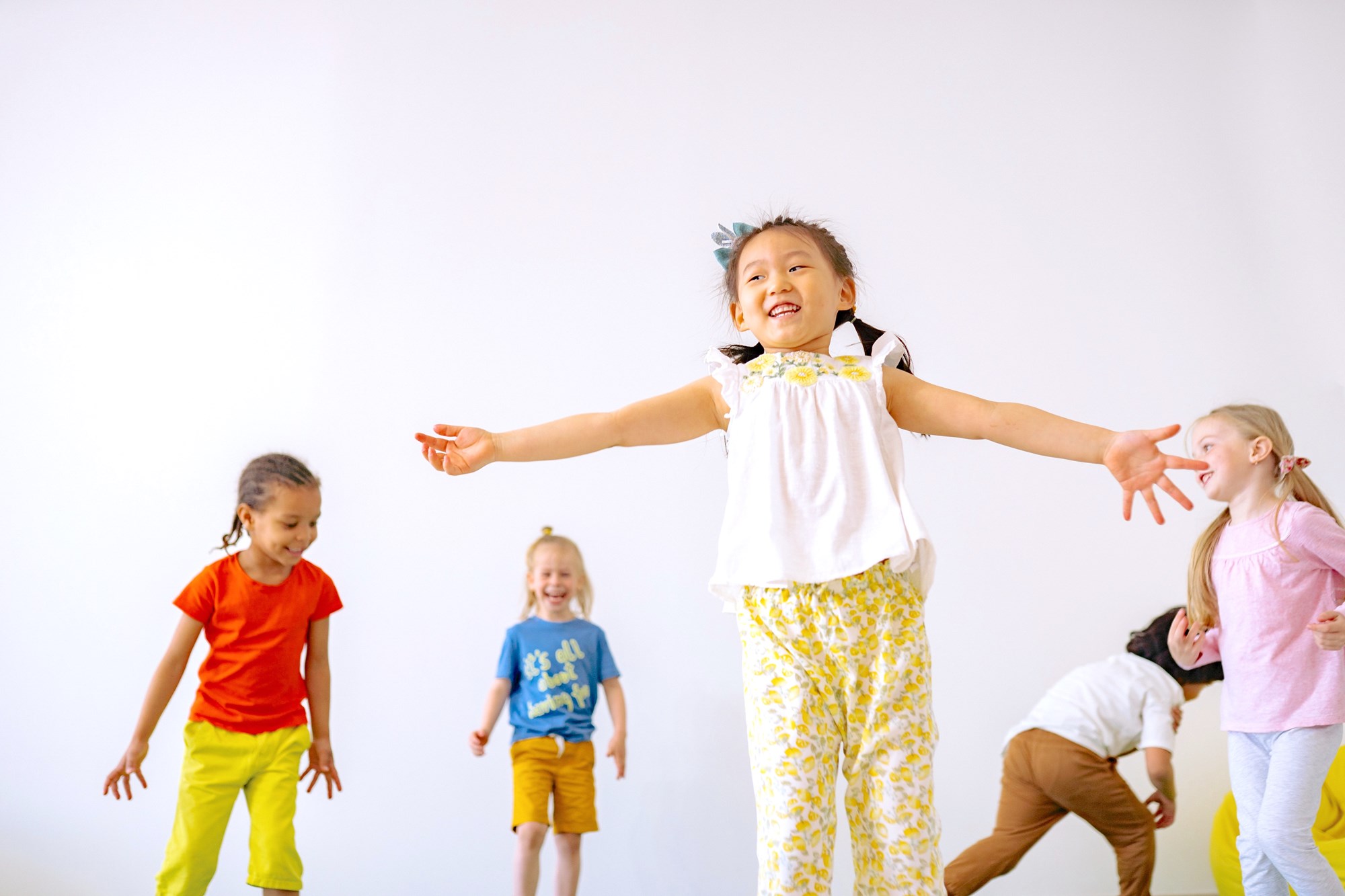 Group of Younger Children Having Fun with Movement