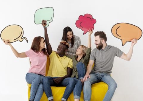 5 people holding blank conversation bubbles over their heads