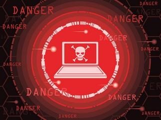 laptop in red and white with a skull and crossbones on the screen