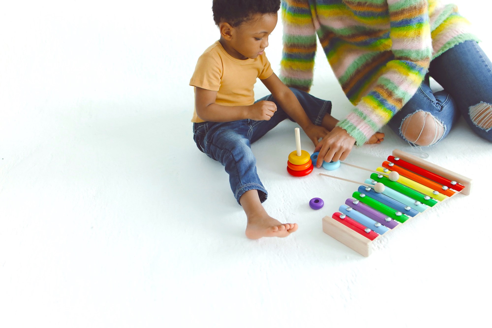 Mother Playing Toys with a Kid on White Background