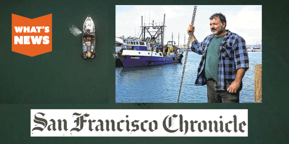 A fisherman standing on dock near his boat