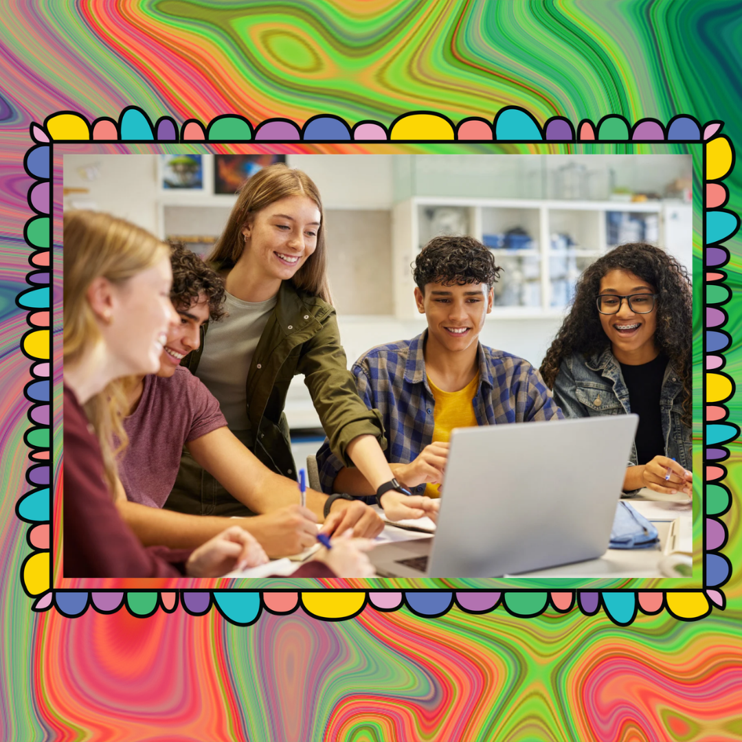 Picture of teens around a computer working together