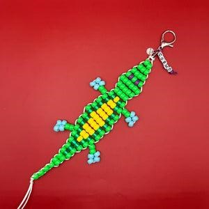 a beaded keychain in the design of an alligator