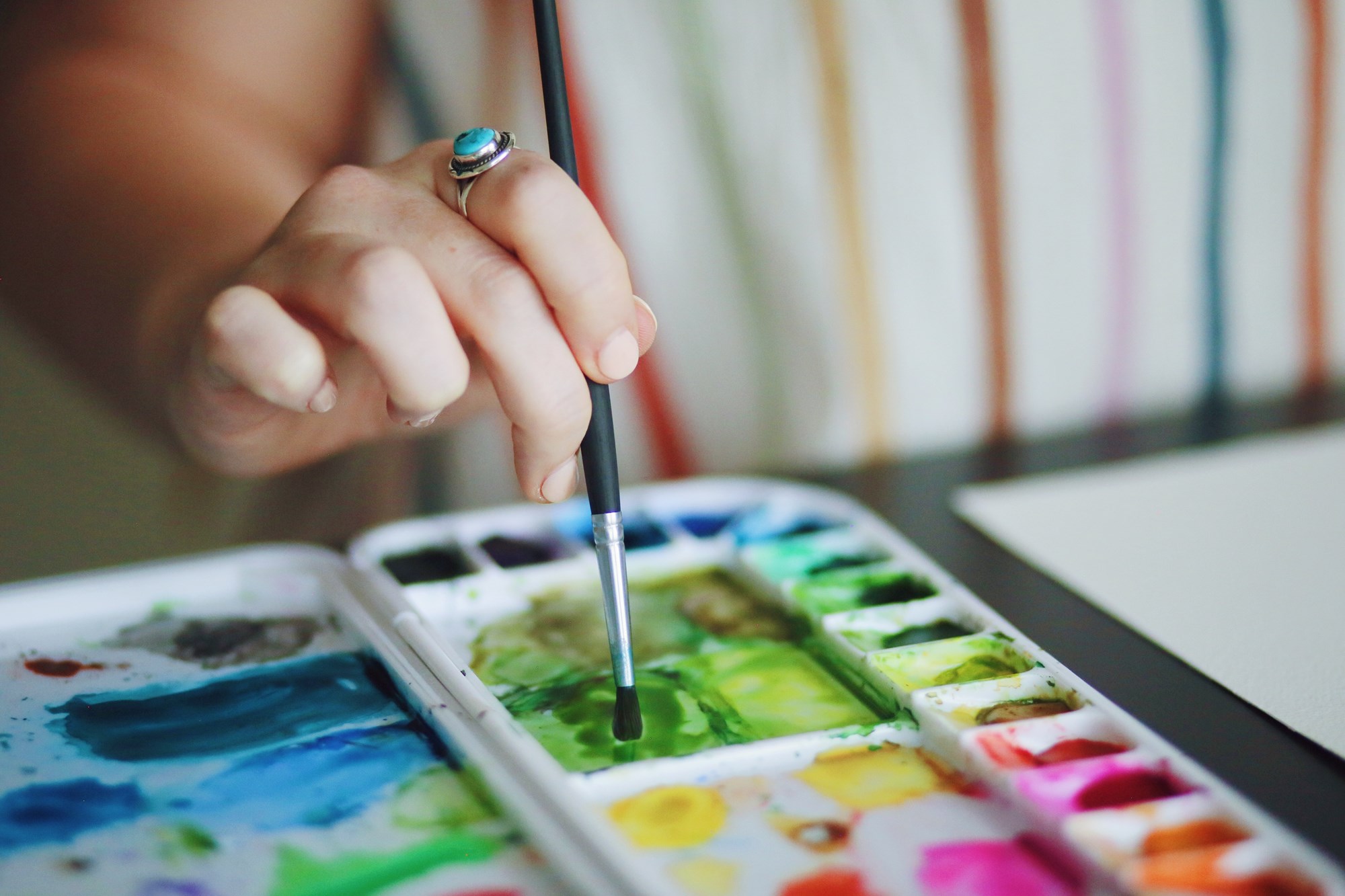 person using watercolor paints