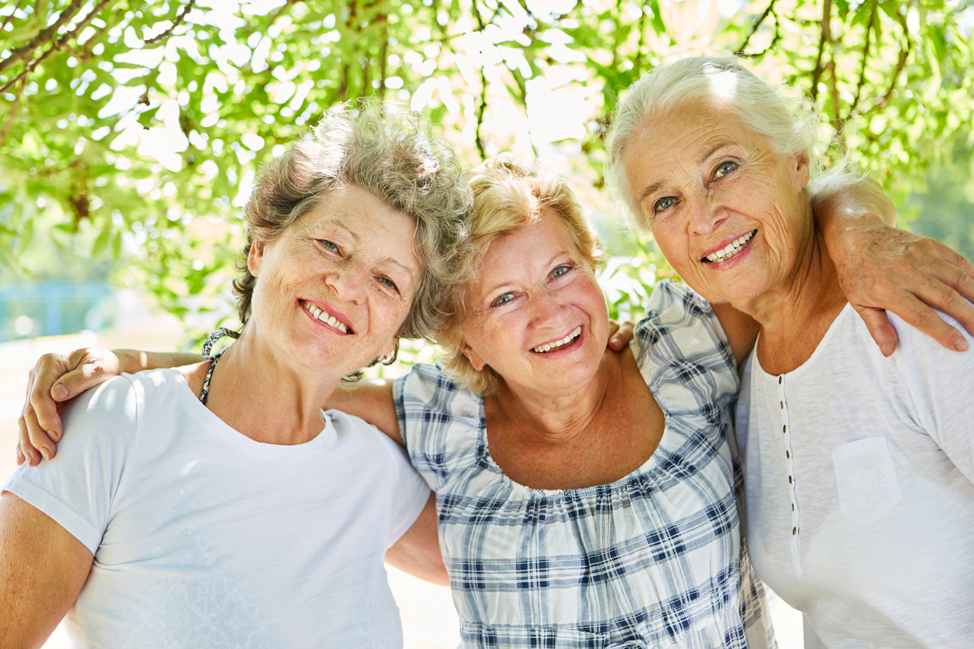 three female friends side by side