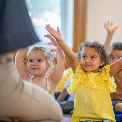 happy toddlers engaged in storytime and activities
