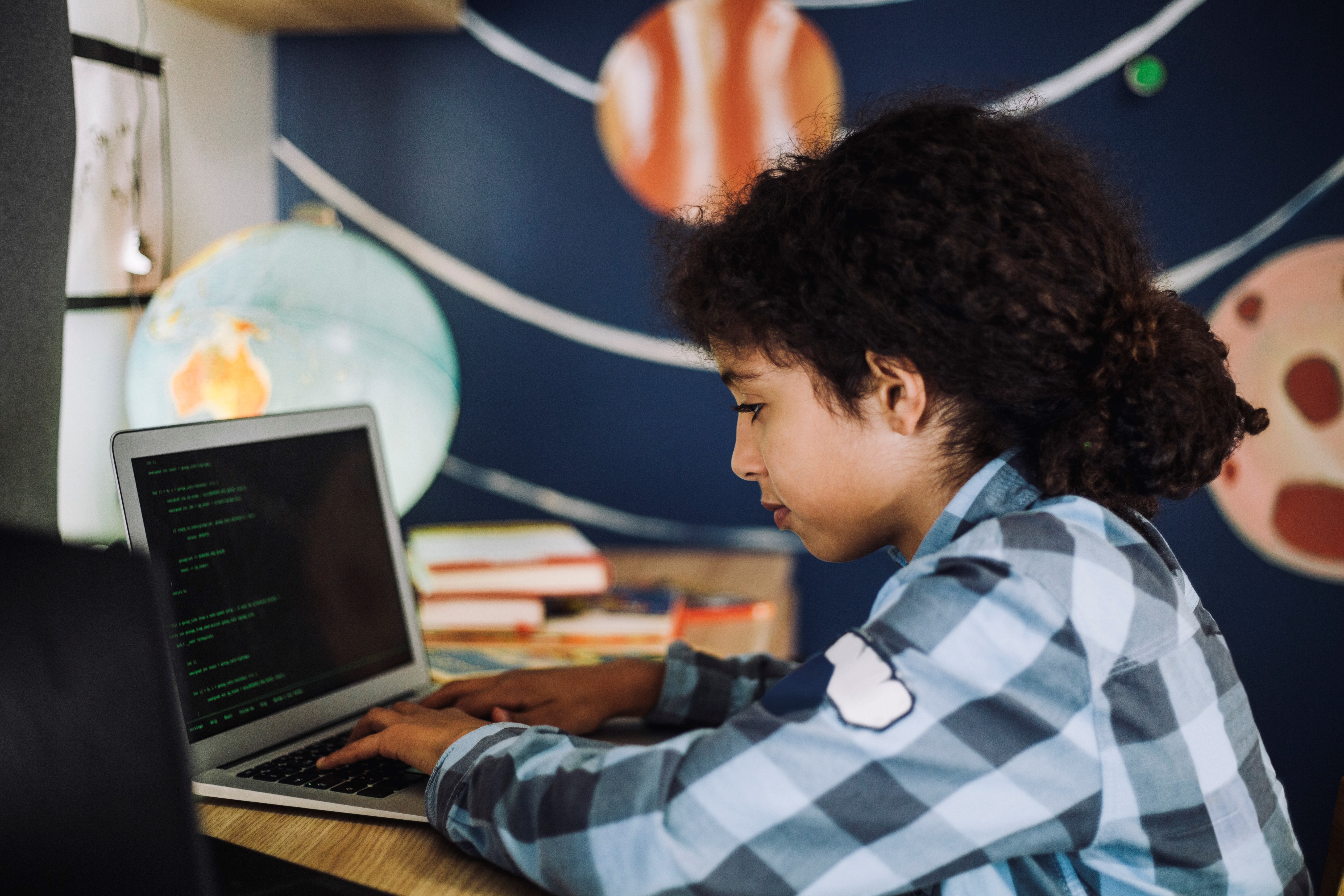 Girl Learning Coding On Laptop At Home