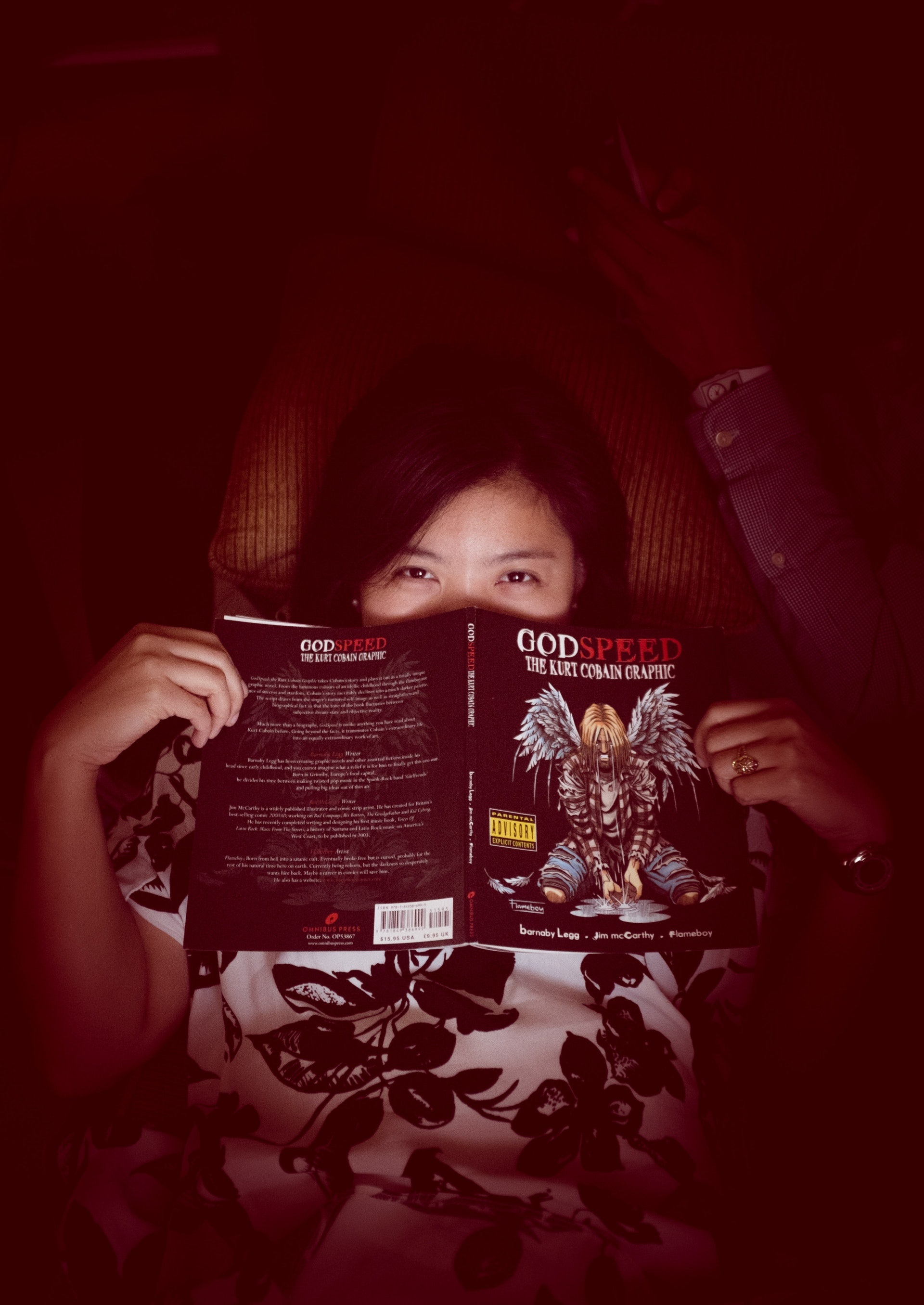 Young Woman Hiding Behind Covering the Book