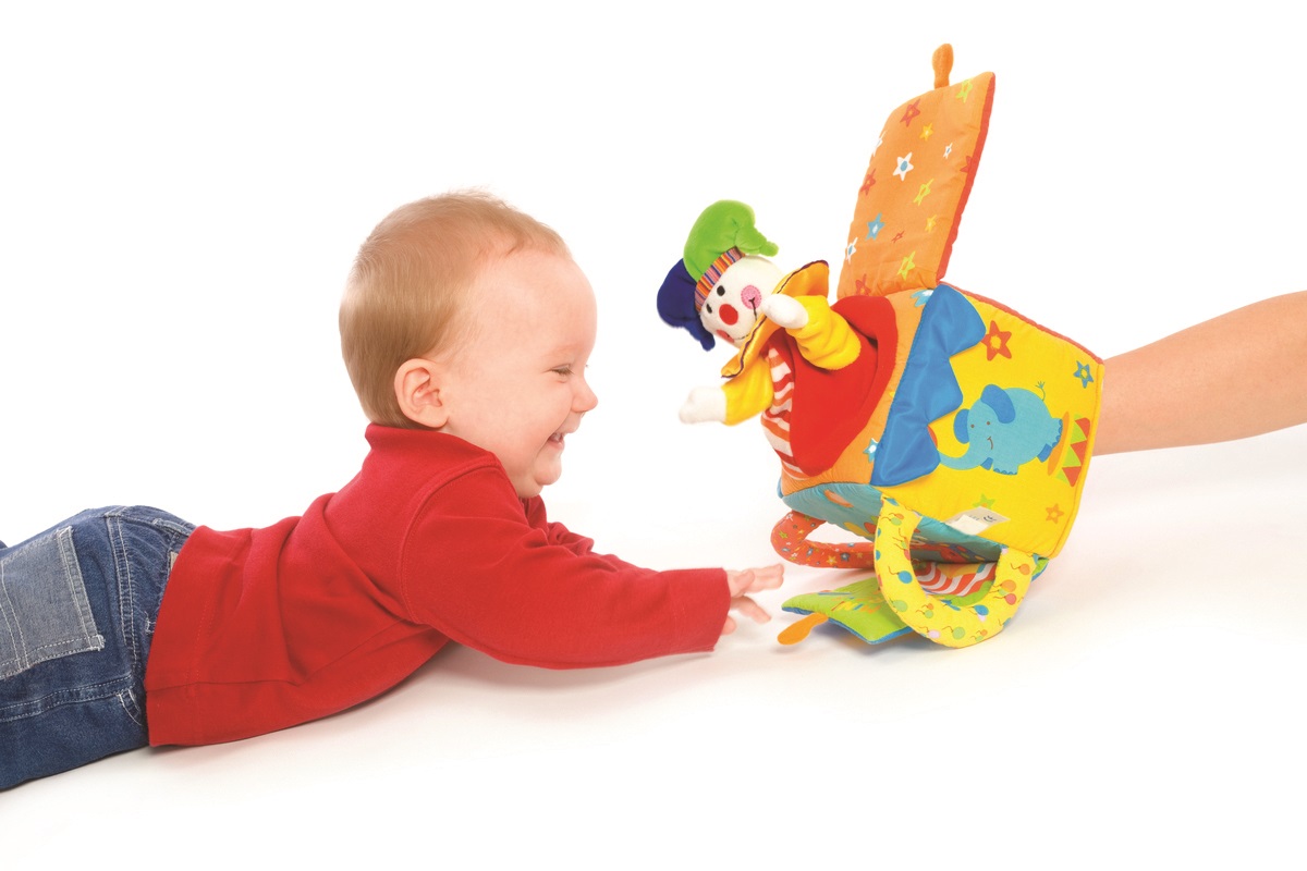 baby playing with jack in the box