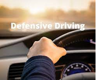 Defensive Driving man holding the wheel
