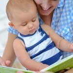 mom reading to baby