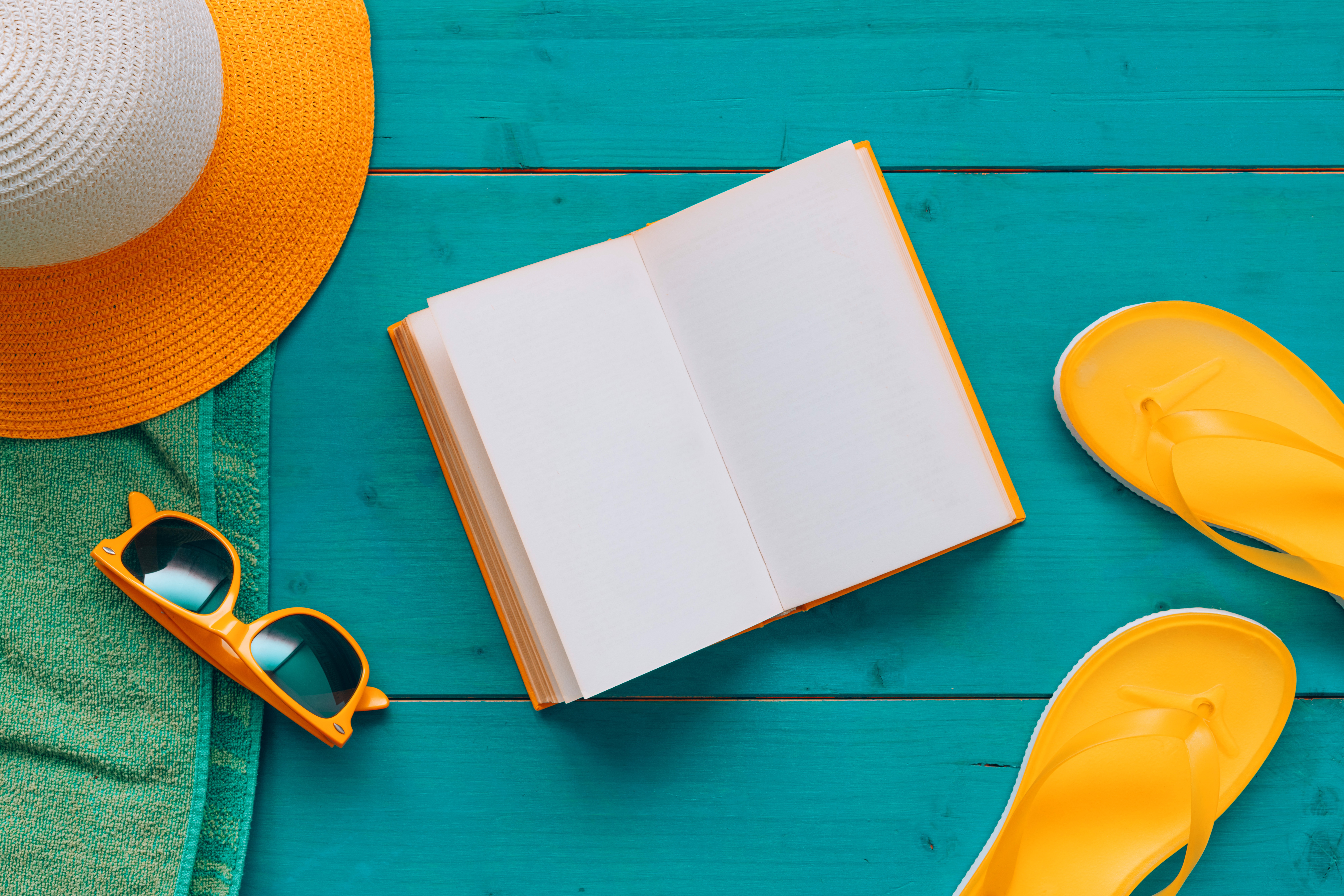 High Angle View Of Book With Blank Mockup Pages On Blue Wooden Boards With Beach Accessories