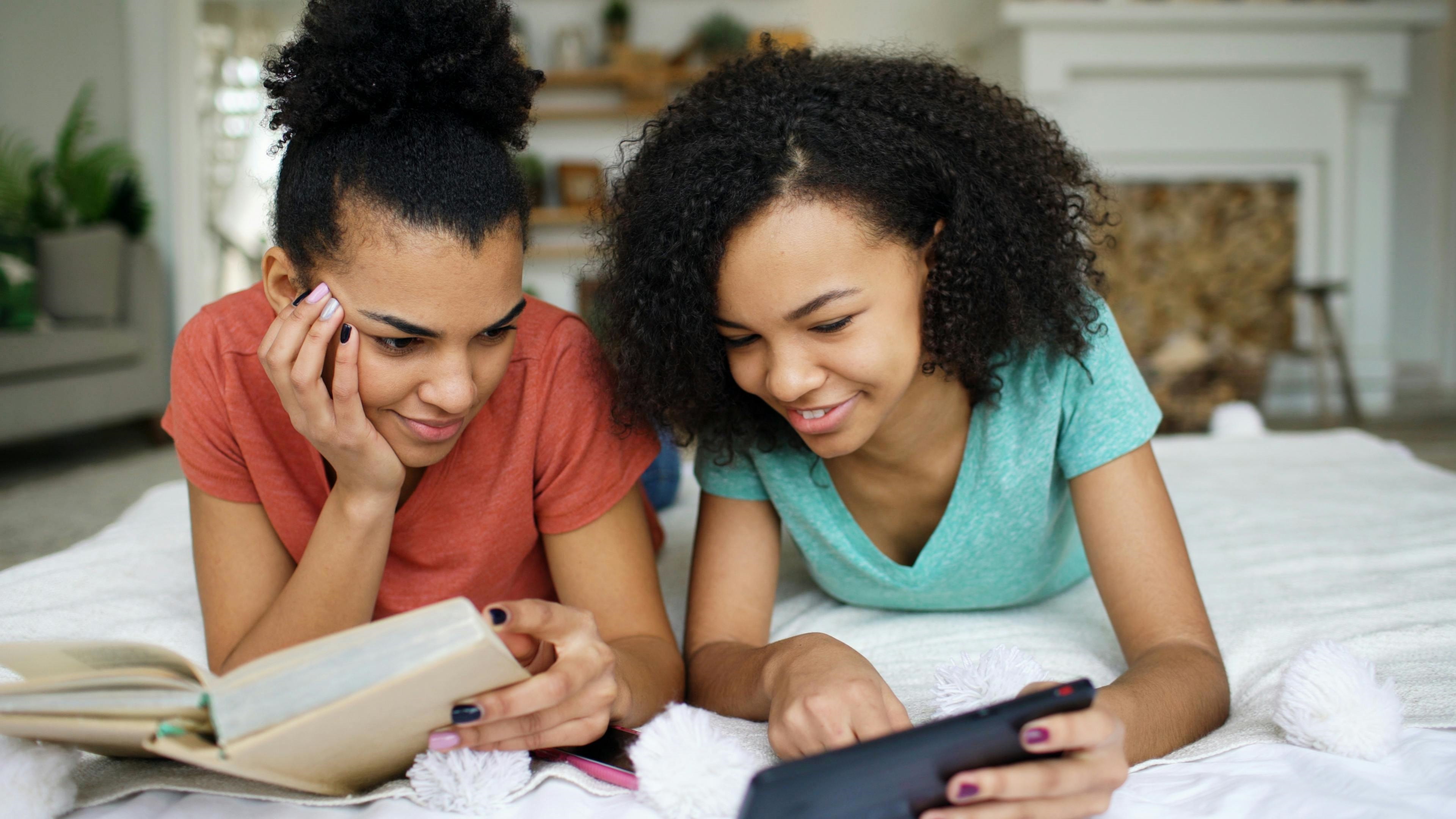 Teen Girls Studying and Using Tablet Together