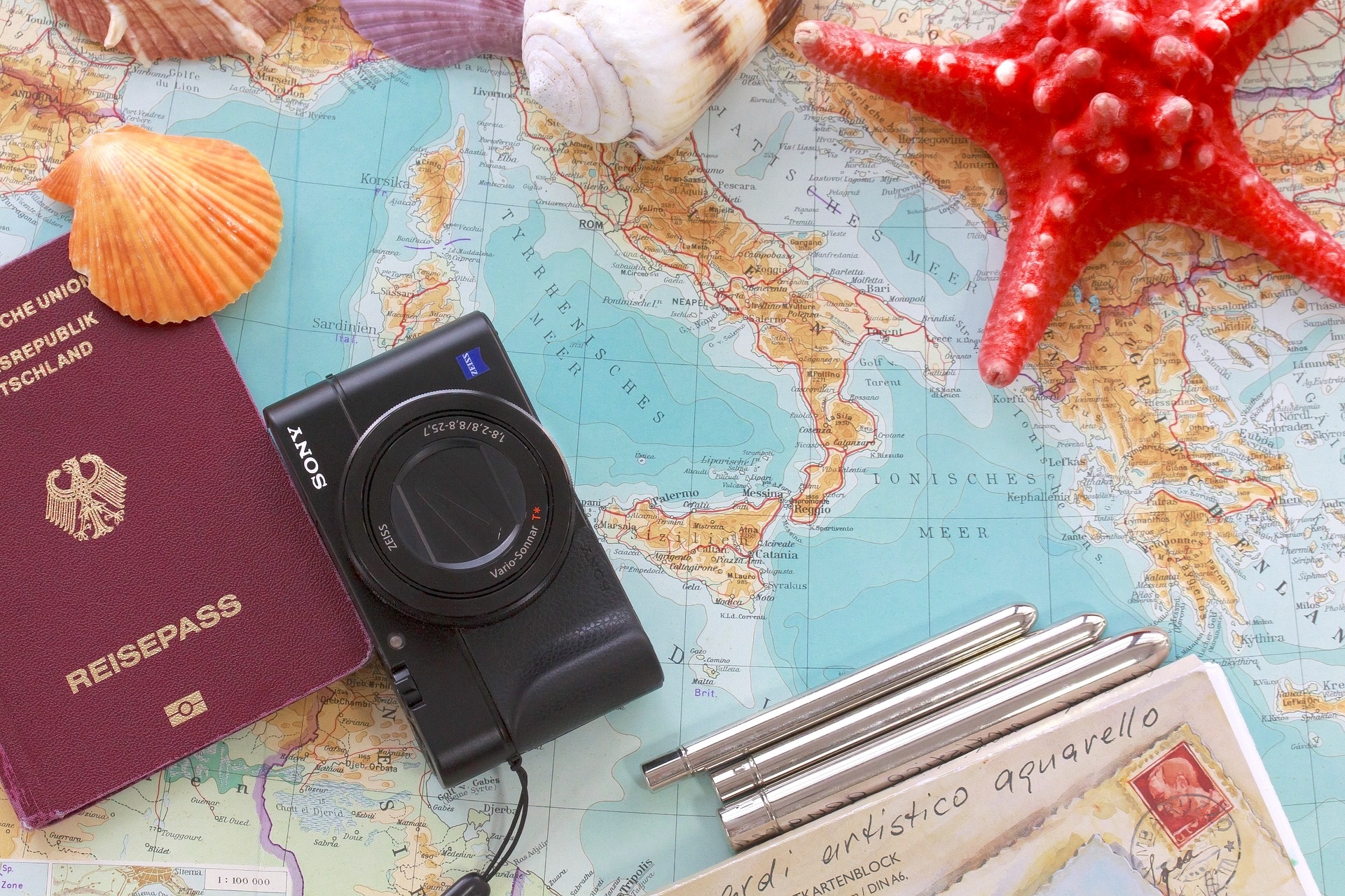 International summer vacations traveling beach maps passport camera