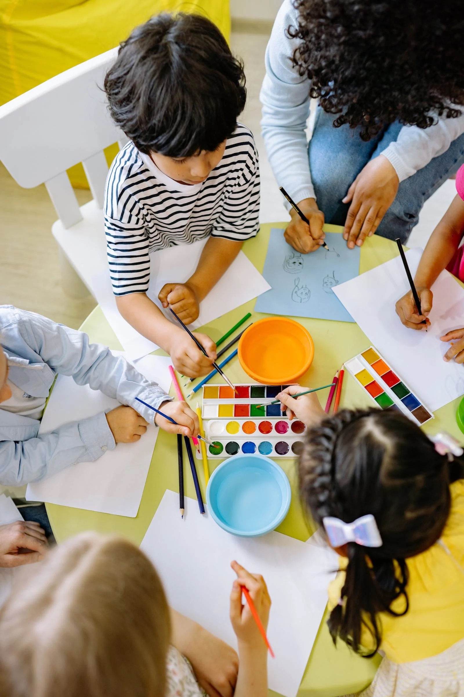 Group of Kids Painting at a Table 2