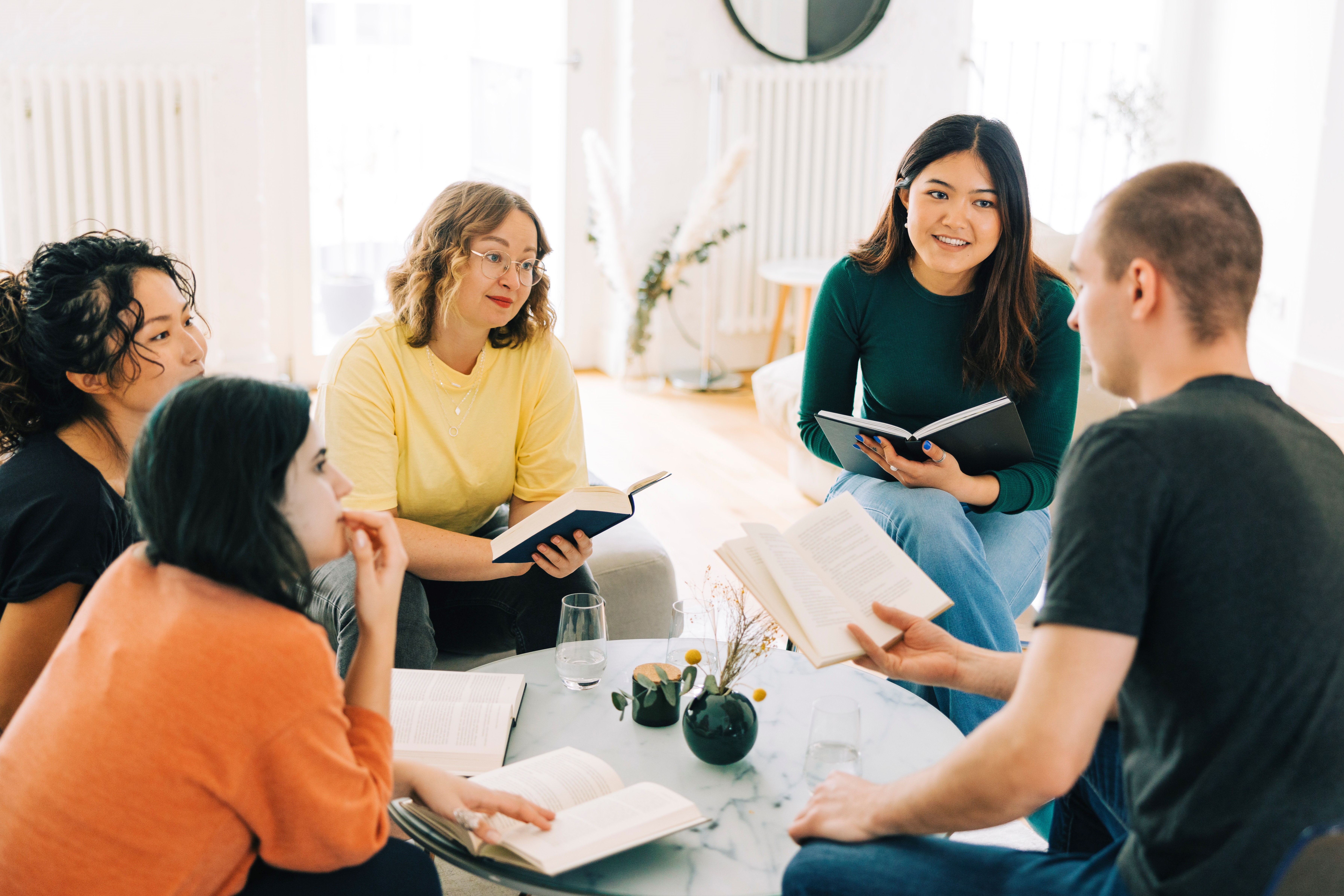 Book Club Members Discussing a Book at Home