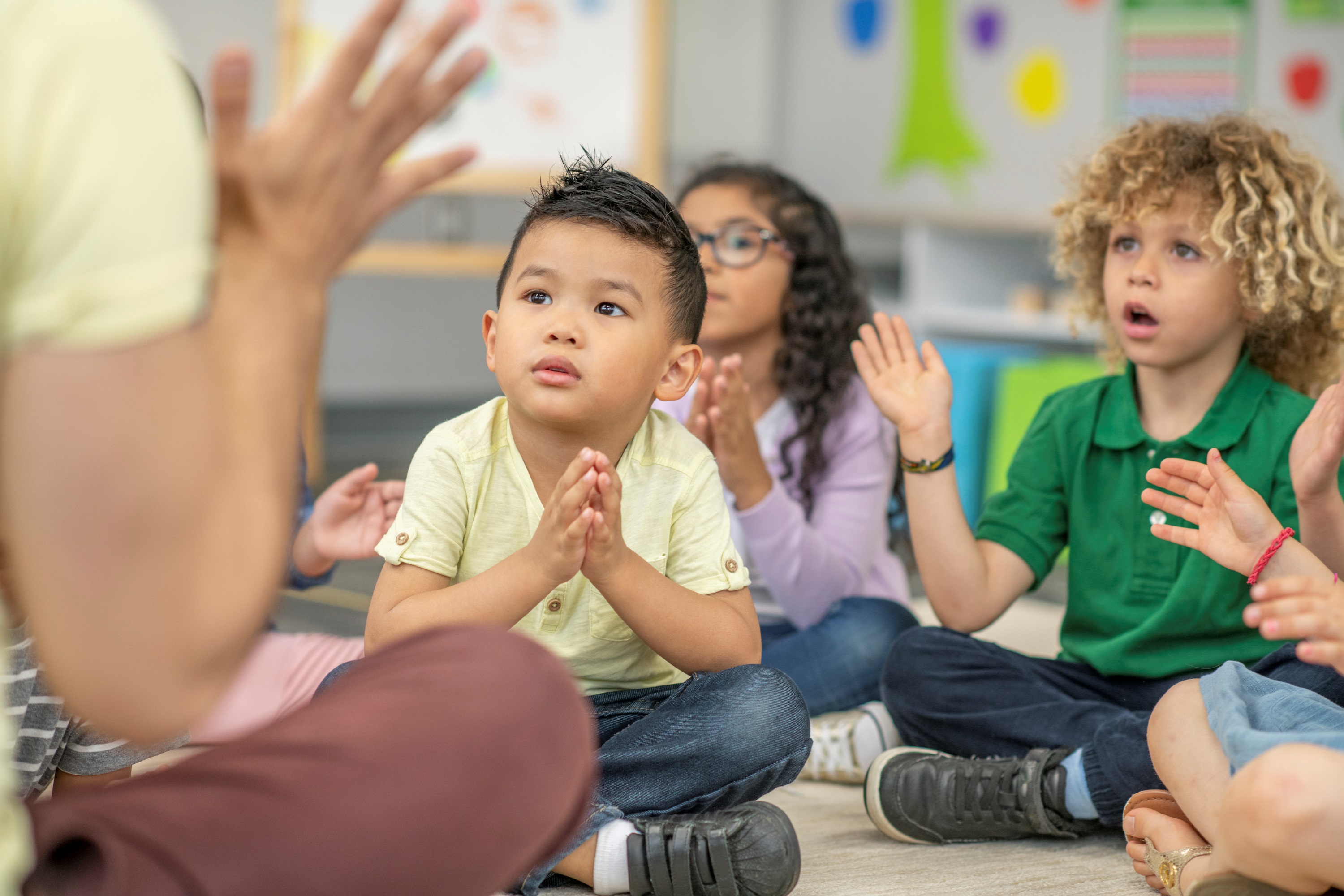 Group of Kindergarten Students is Sitting on the Floor