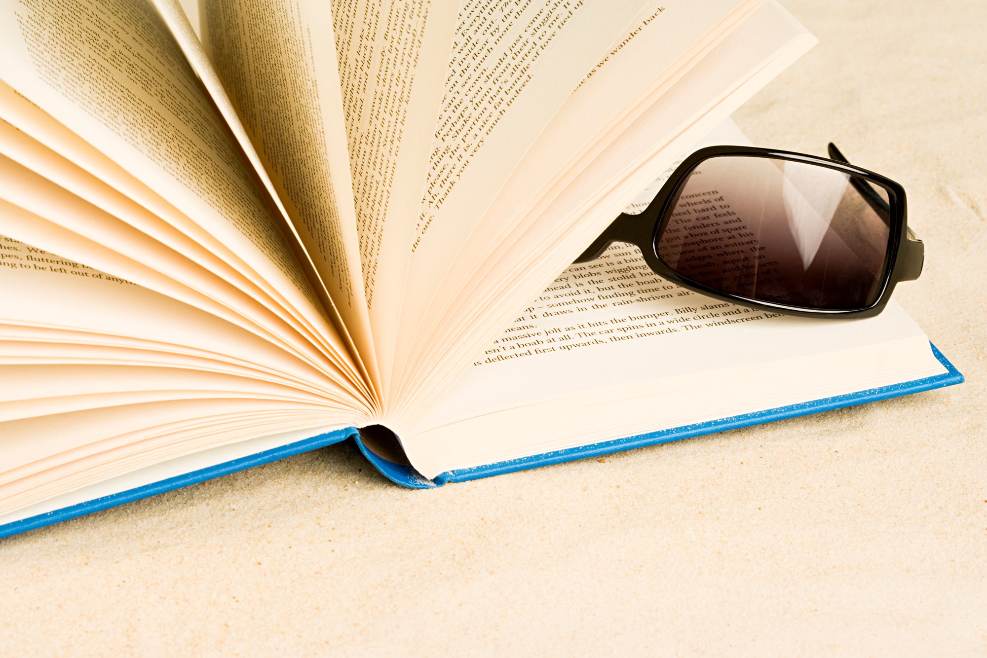 Book and Sunglasses on the SAnd