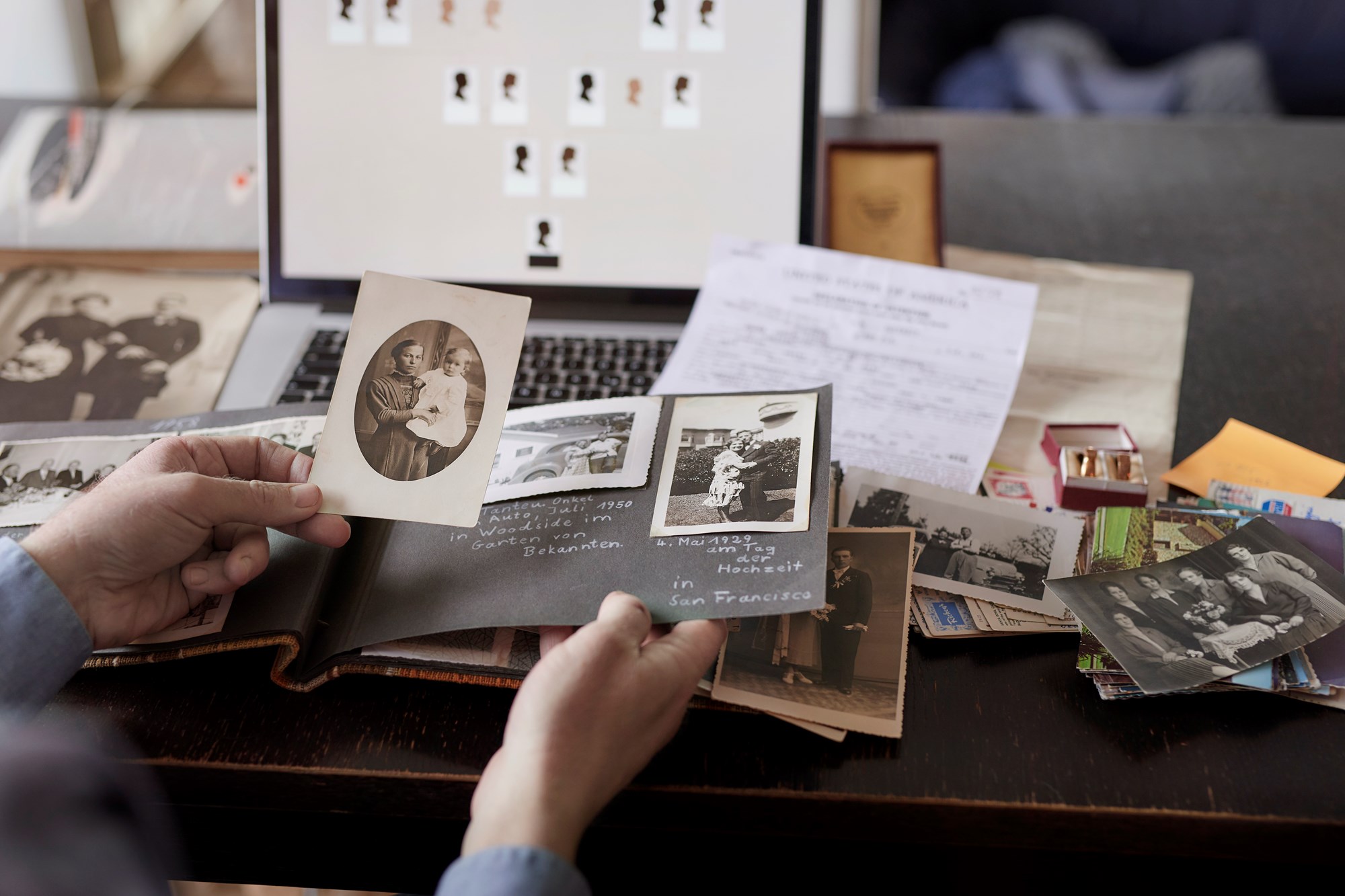 Man Researching Family Tree On Computer At Table