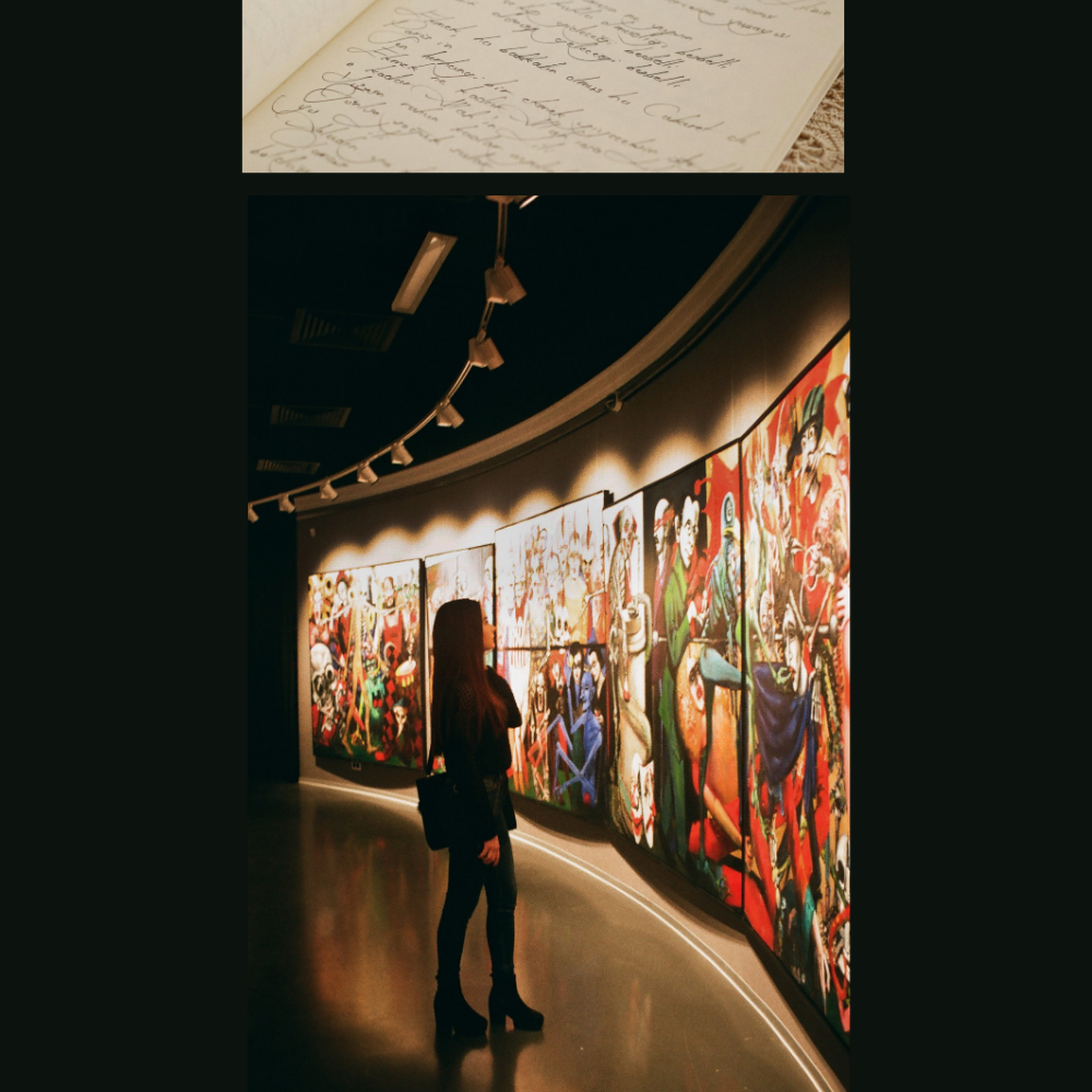 A woman staring at a large mural in a gallery