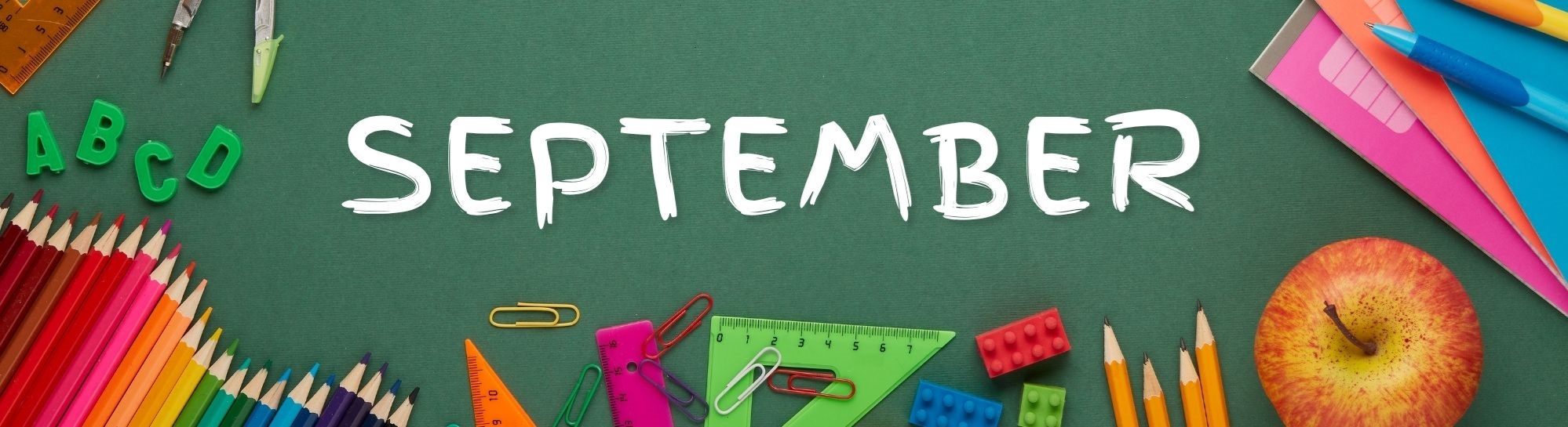 School supplies surrounding the word September on a chalkboard background