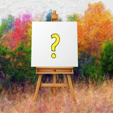 Easel with canvas with a question mark on it with a colorful background.