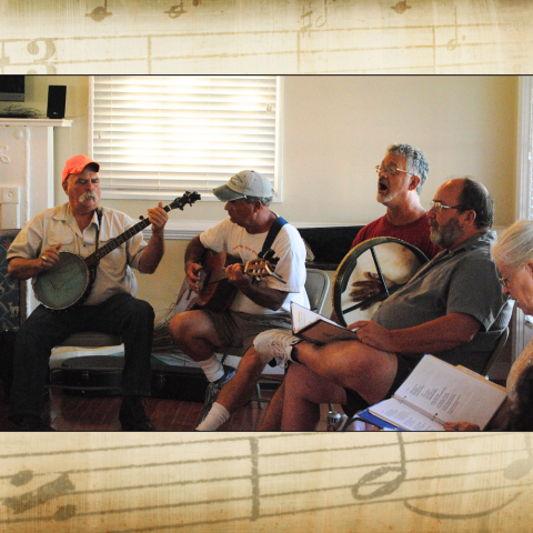 Group of people singing and playing instruments