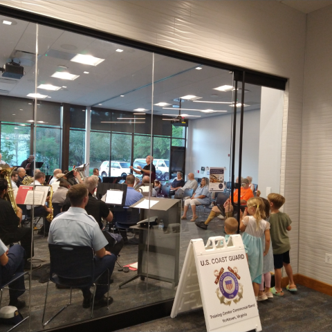 Large instrumental band performing indoors