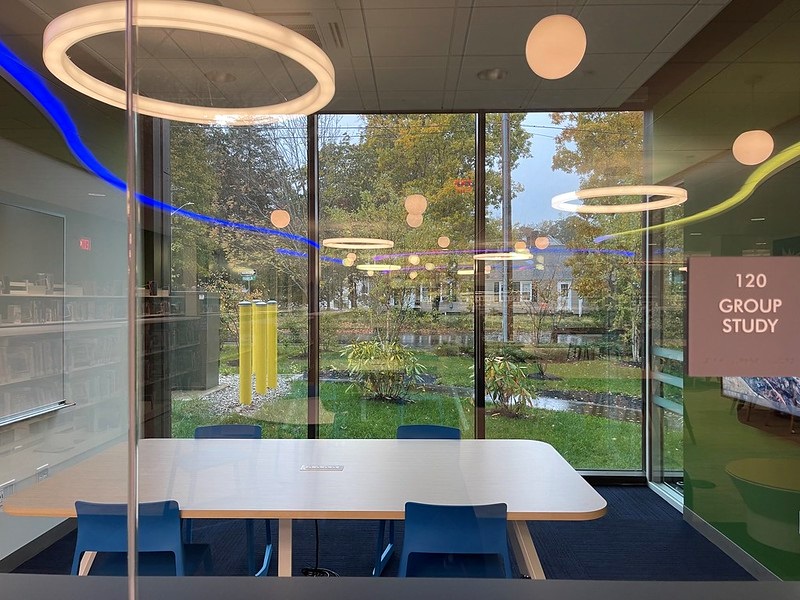 Woman Using a Laptop in her Kitchen

