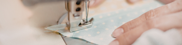 a decorative chain of folded pink and red paper hearts hanging in a garland