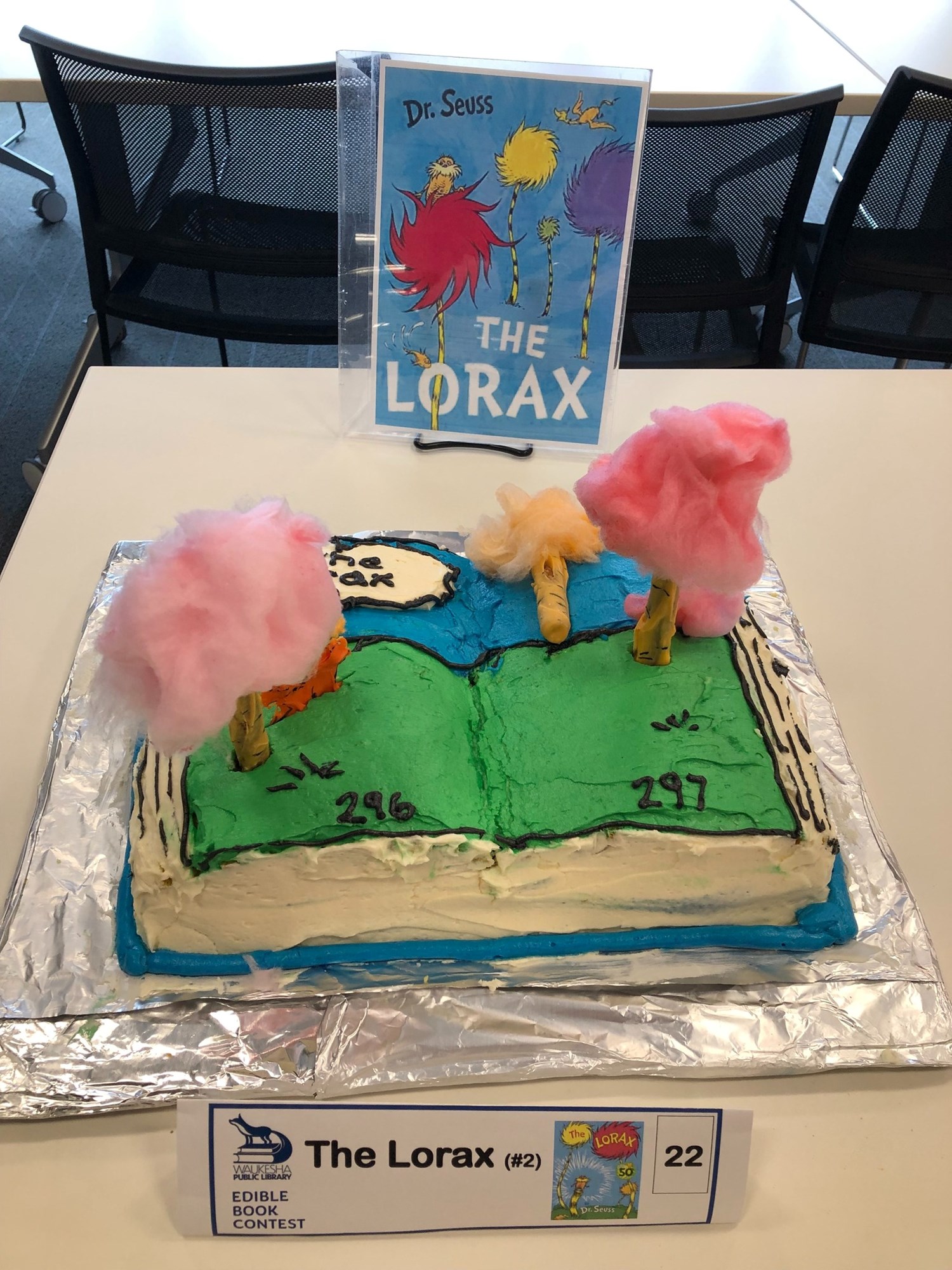 A decorated cake features The Lorax characters from Dr. Seuss's book