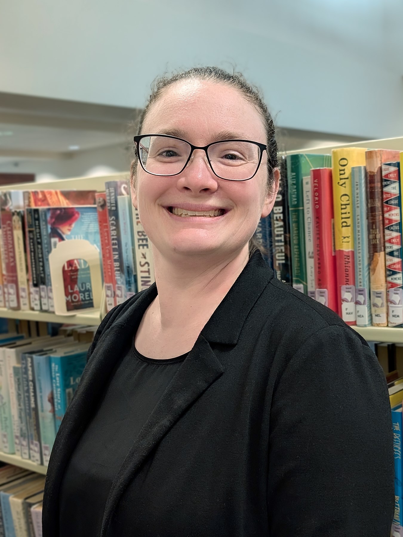 Headshot photo of Brittany Larson, new Director of Bridges Library System.
