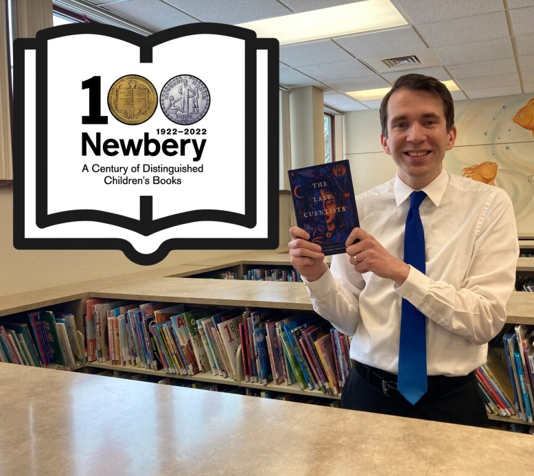 Photo of Peter with the Newbery 100th anniversary logo on the left.