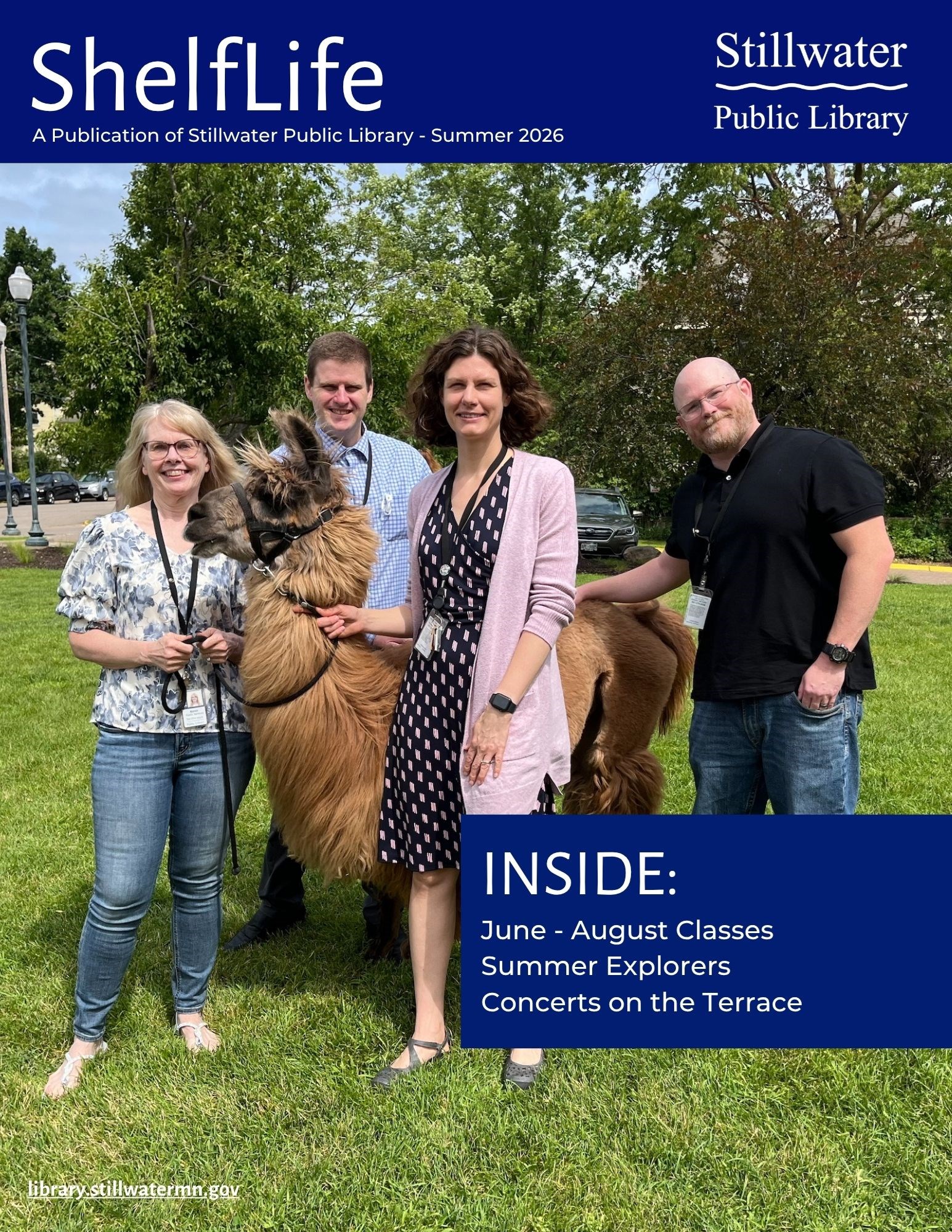 4 librarians with a llama on the library lawn in summer
