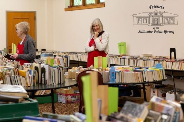 Two Friends volunteers sorting books for sale