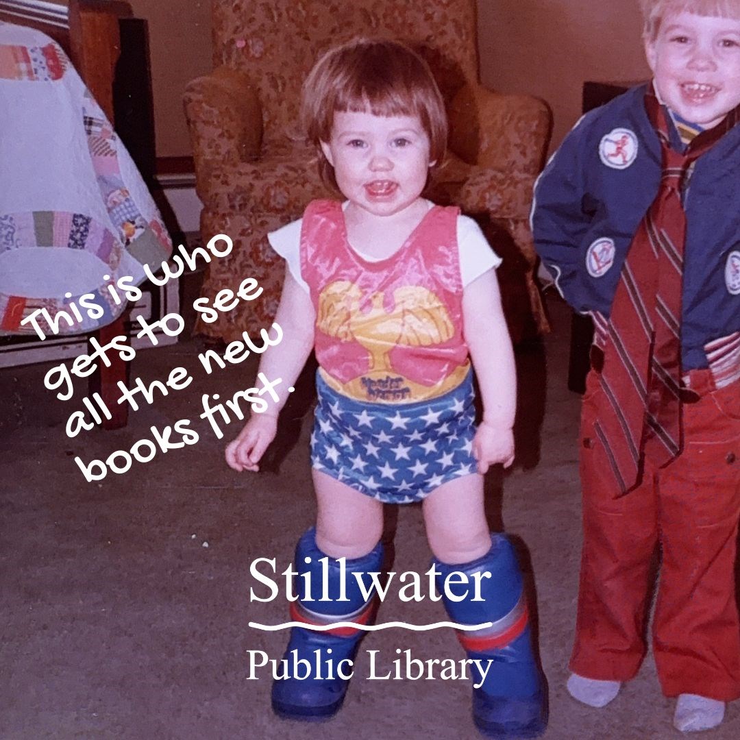 Girl wearing wonder woman costume and text ' This is who gets to see all the new library books first.'