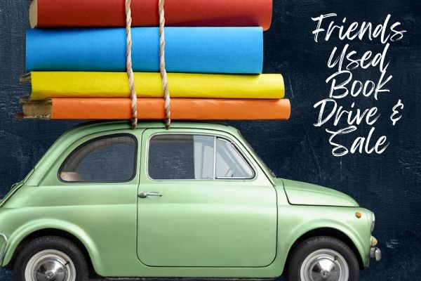 Mint green toy-sized car with large orange, yellow, blue and red books twined to top