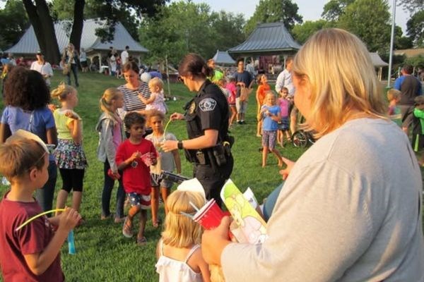 Police Officer and kids/families at park for Night to Unite