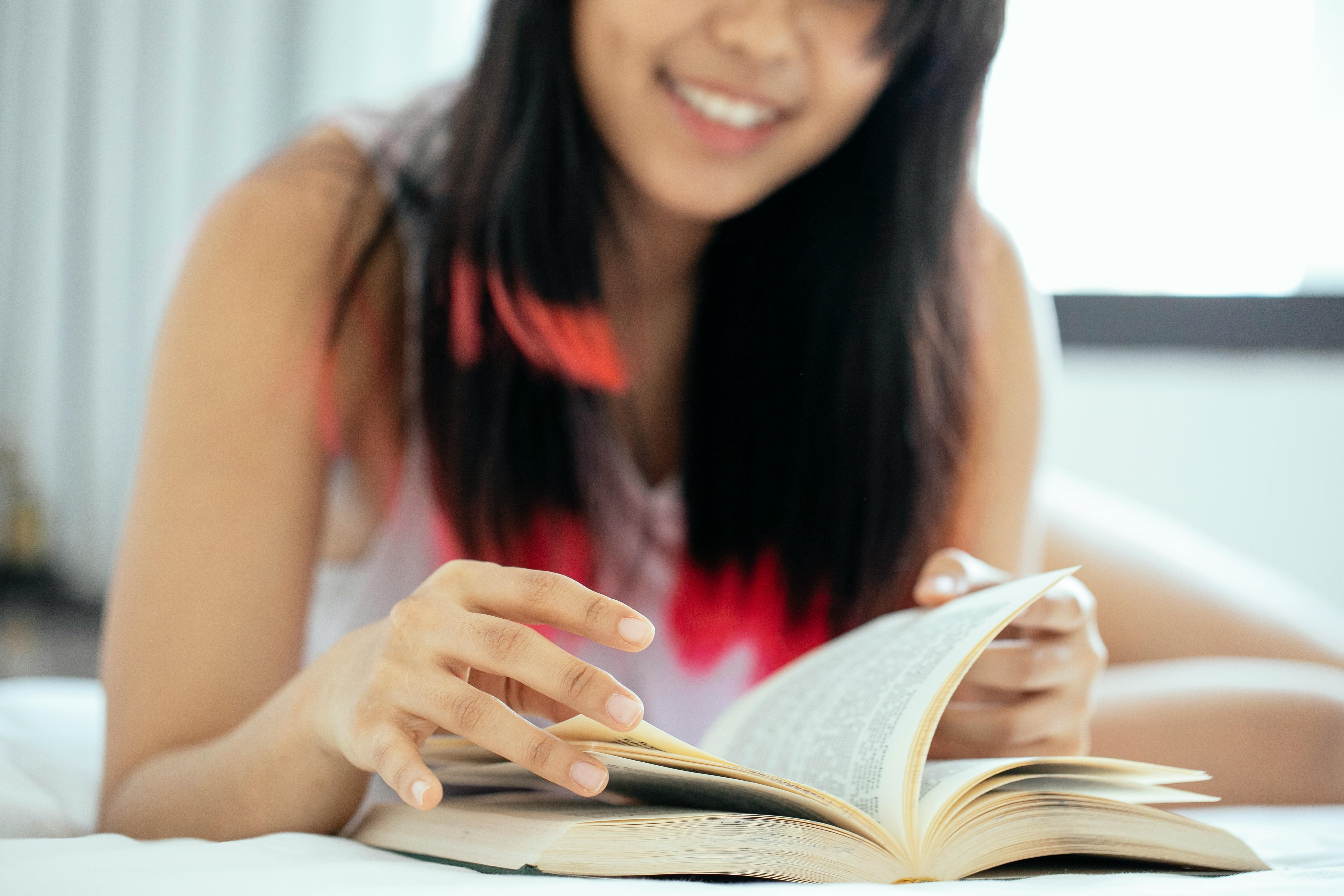 Young Woman Opening a Book