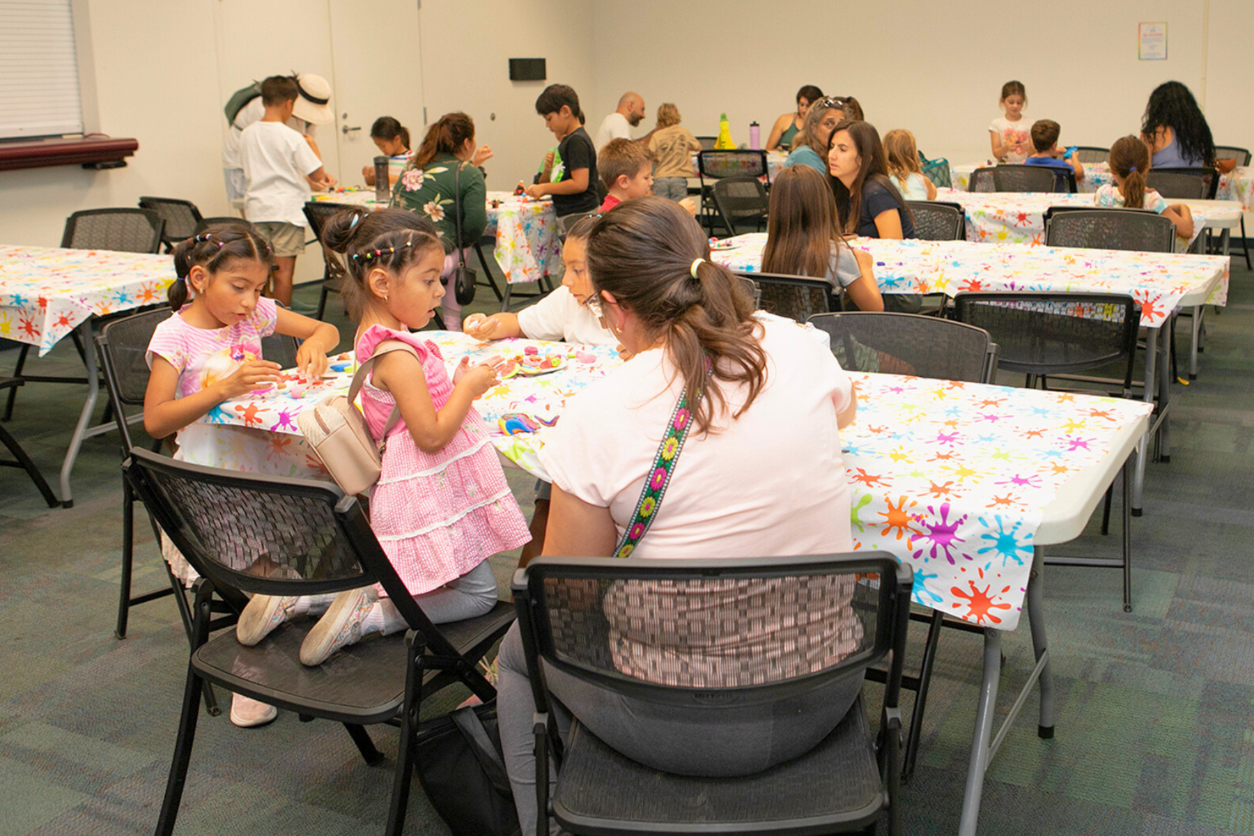 Parent and child participating in a craft,
