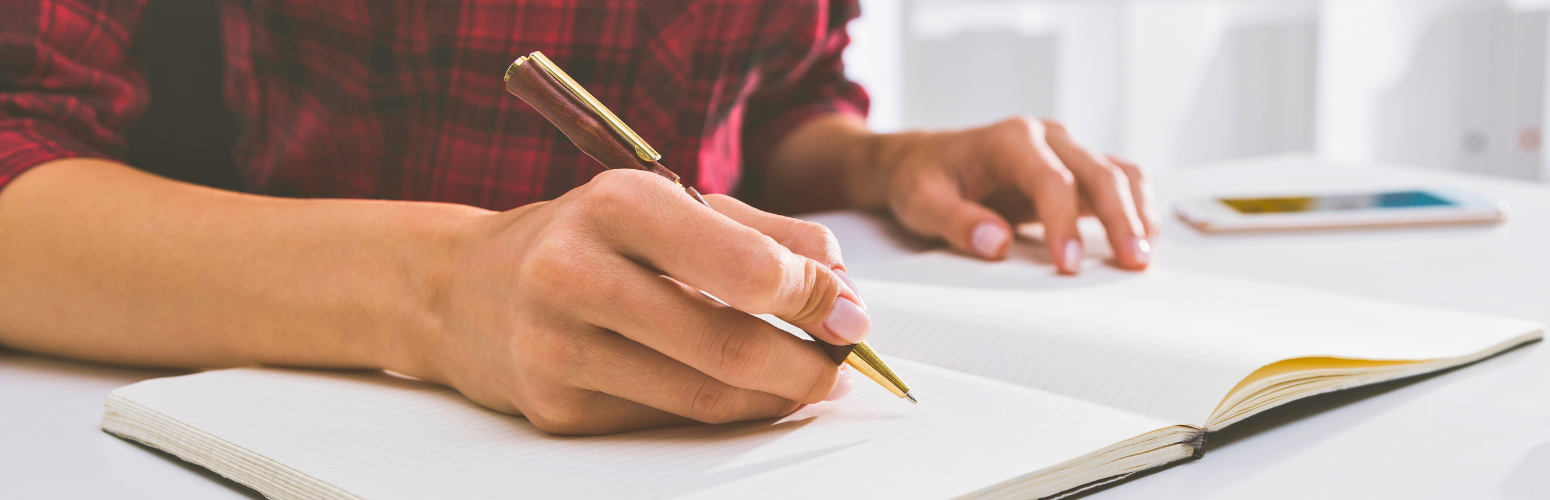 Hand writing in an open journal. Hand writing in an open journal.