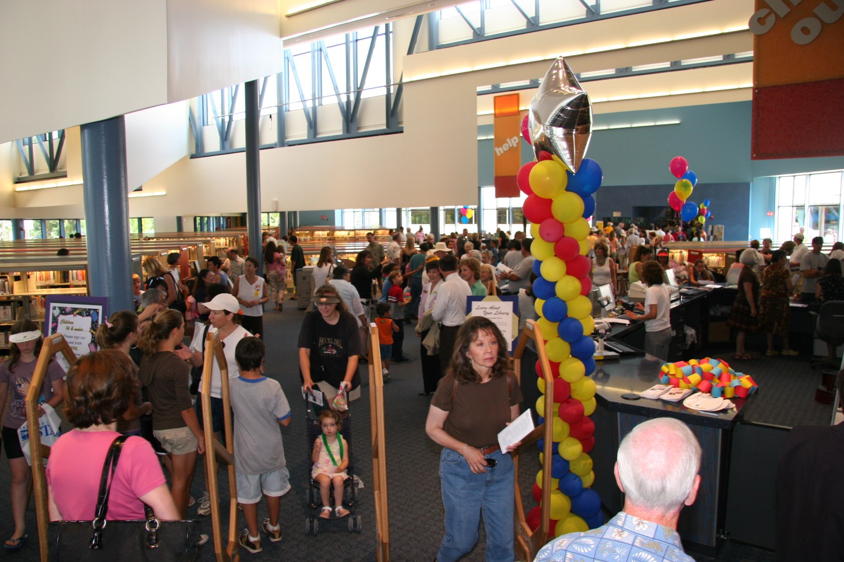 Families and children exploring books and activities at the Children’s Expansion Celebration in 2006. Families and children exploring books and activities at the Children’s Expansion Celebration in 2006.